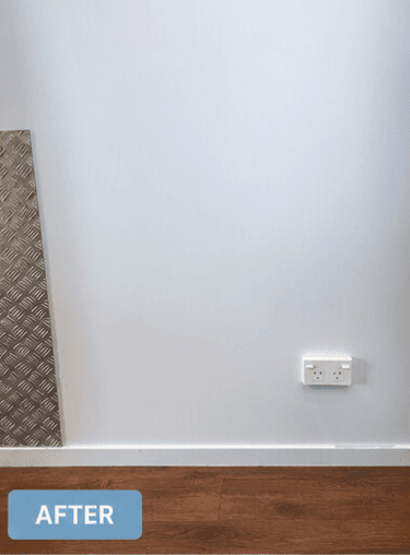 After — wall restored by Assured Cleaning Services