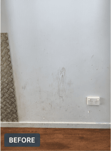 Before — scuff marks on commercial wall in Papamoa